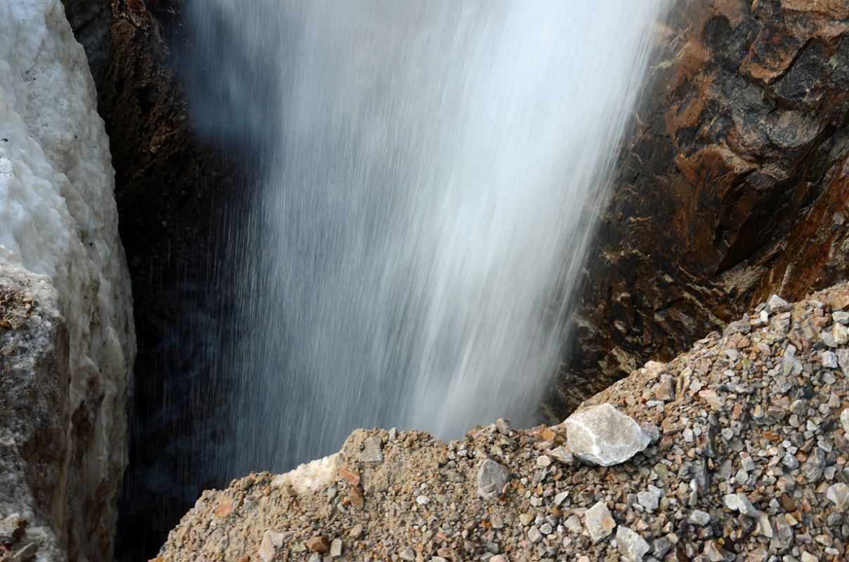 20 Carefully Looking Down At Waterfall From Angel Glacier From Top Of Climbing Scree Slope On Mount Edith Cavell